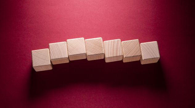 Wooden Geometric Shapes Cube on a paper background , This can use for past your words