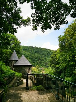 A path with trees on the side of a building. High quality photo