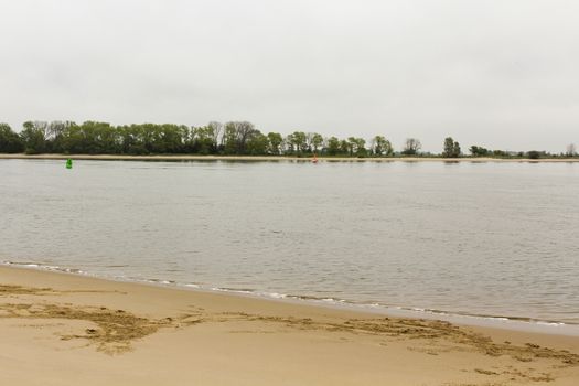 Rough and cold Weser beach in Brake Unterweser Lower Saxony Germany. Harrier Sand.