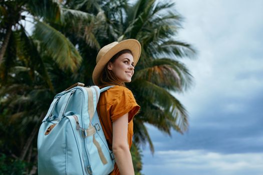 Woman tourist backpack travel vacation palm trees destination landscape