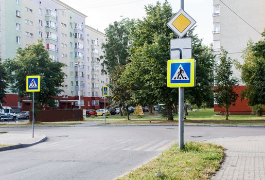 empty pedestrian crossing on a city street on summer day