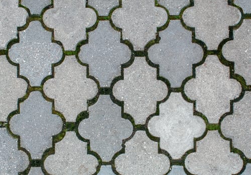 road paved with sidewalk tiles. beautiful brick background with, masonry texture of light gray bricks. outdoor closeup