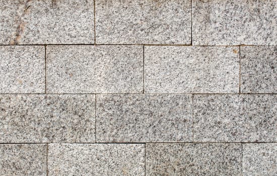 road paved with sidewalk tiles. beautiful brick background with, masonry texture of light gray bricks. outdoor closeup