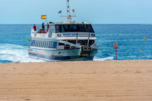 Lloret de Mar, Spain : 2020 2 Sept : Boat in the beach of Lloret de Mar after Covid 19 without international tourists in summer 2020