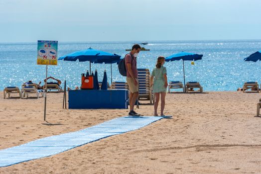 Lloret de Mar, Spain : 2020 2 Sept : People in the beach of Lloret de Mar after Covid 19 without international tourists in summer 2020