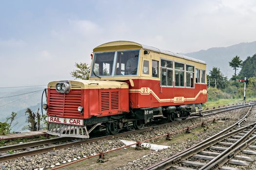 Shoghi,Himachal Pradesh,India-April 14th, 2015: Indian Railway's narrow gauge, Shimla to Kalka Rail car vehicle , passing through Shoghi station.