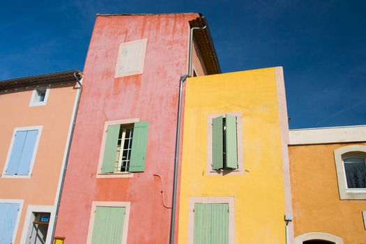 The beautiful colorful buildings of Roussillon on a winter's afternoon in Provence, France