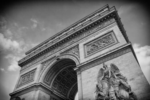 The historic Arc de Triomphe in black and white detail in Paris, France