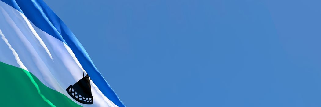 3D rendering of the national flag of Lesotho waving in the wind against a blue sky