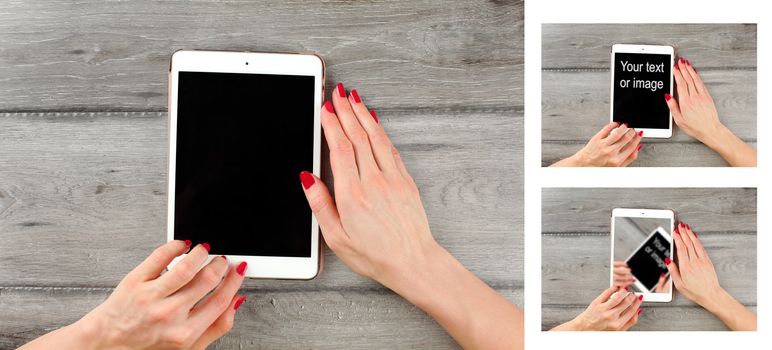 Table top view on young woman hand holding tablet, on gray wood desk. Select black color and add your text or image to tablet screen.