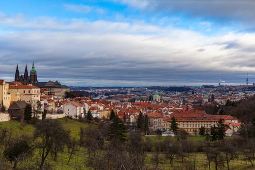 Panorama aerial view of Prague cityscape and skyline with Prague Castle and St. Vitus Cathedral in Mala Strana old town from Petrin Hill on the day with blue sky cloud, Czech Republic.