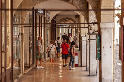 TREVISO, ITALY 13 AUGUST 2020: People walking on arcades in Treviso in Italy