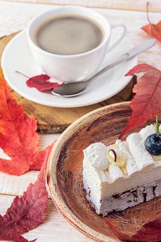 Cake sweet dessert. Cake with currants and coffee. Red autumn leaves