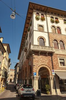 TREVISO, ITALY 13 AUGUST 2020: Historical buildings with arcades in Treviso city center in Italy