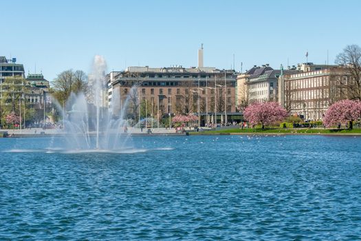 Bergen, Norway, May 2015: View on Lille Lungegardsvannet, lake in the city of Bergen, Norway, with fountain and surrounding buildings