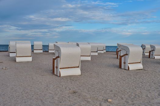 Empty beach cabins on a deserted beach at the baltic sea in the morning.