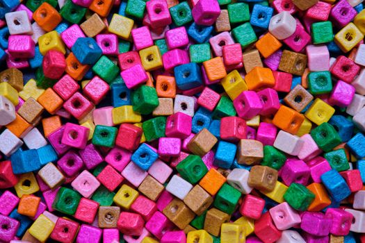 Various sewing Colorful wooden beads as background.