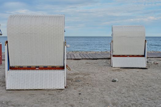 Empty beach cabins on a deserted beach at the baltic sea in the morning.