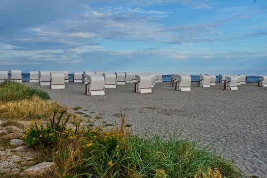 Empty beach cabins on a deserted beach at the baltic sea in the morning.