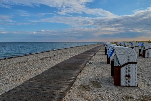 Empty beach cabins on a deserted beach at the baltic sea in the morning.