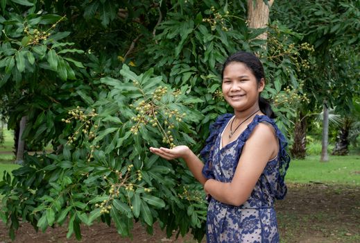 Woman and Longan in Thailand