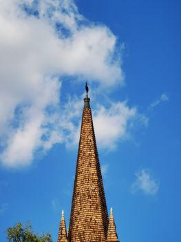 A large tall tower with a clock on the side of a building. High quality photo