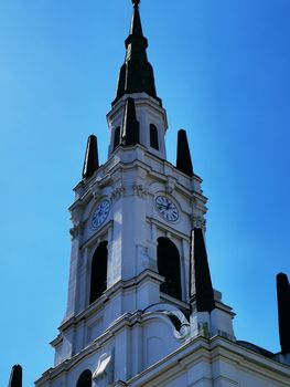 A large tall tower with a clock at the top of a building. High quality photo