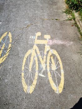 Bicycle lane marking yellow paint on the sidewalk High quality photo