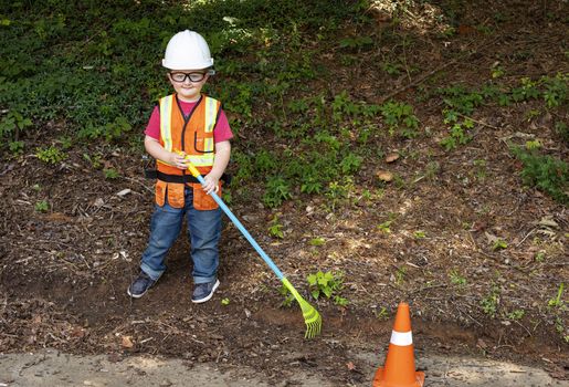 Young boy dressed for his role as a construction worker.