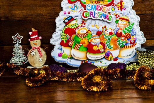 Decorations and ornaments for decorating the Christmas tree in a colorful Christmas composition,