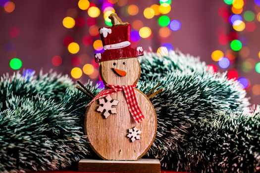 Decorations and ornaments in a colorful Christmas composition isolated on background of blurred lights.