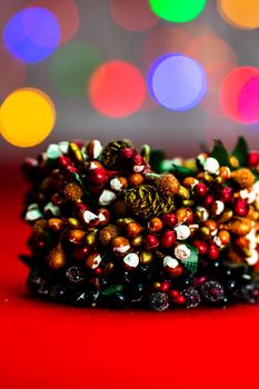 Colorful decorated Christmas wreaths isolated on background of blurred lights.