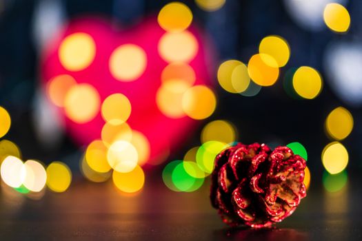 Decorations and ornaments in a colorful Christmas composition isolated on background of blurred lights.