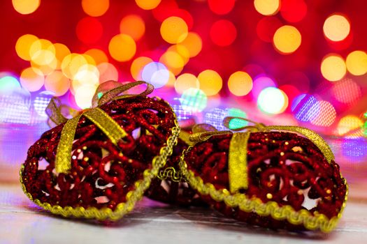 Decorations and ornaments in a colorful Christmas composition isolated on background of blurred lights.