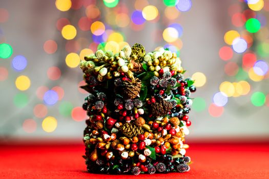 Colorful decorated Christmas wreaths isolated on background of blurred lights.