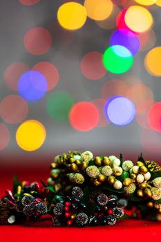 Colorful decorated Christmas wreaths isolated on background of blurred lights.