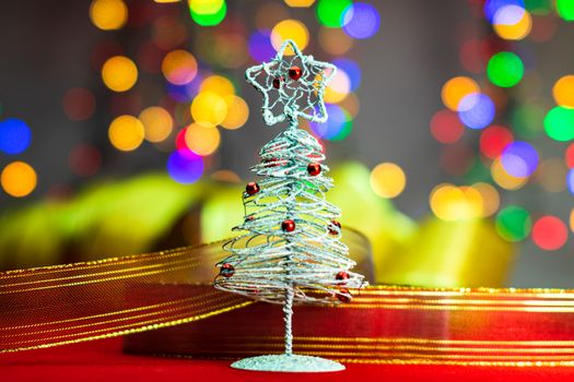 Christmas tree decoration ornament isolated on blurred background of  lights