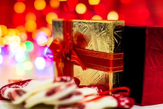 Decorations and ornaments in a colorful Christmas composition isolated on background of blurred lights.