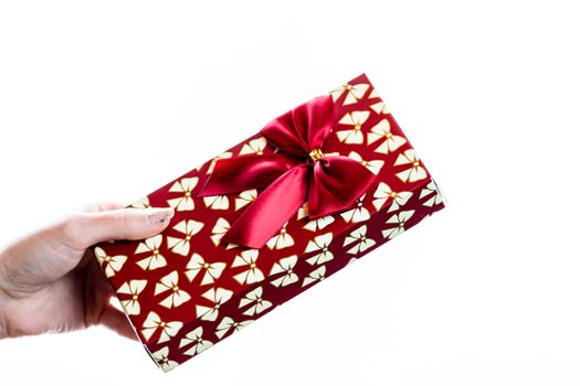 Hand showing holding giving or receiving gift present box isolated on white background.