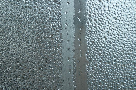 Bright grey color glassy texture, with water drops on it. Water drop glassy background