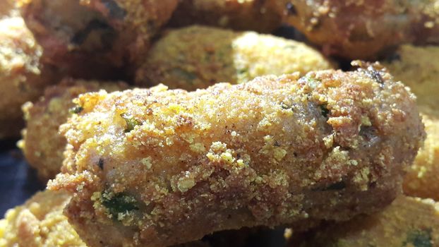 Closeup perspective view of home made spicy and delicious croquettes served with tea or other dishes during parties as fast food.