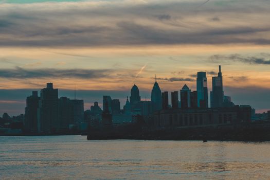 A View of the Philadephia Skyline Over Water On a Dramatic Blue and Orange Sunse