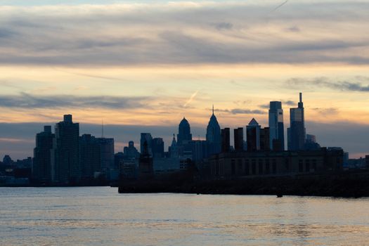 A View of the Philadephia Skyline Over Water On a Dramatic Blue and Orange Sunse