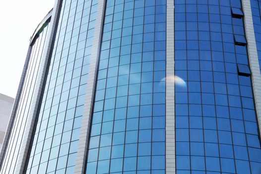 fragment of the glass facade of a skyscraperclose up