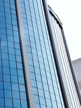 fragment of the glass facade of a skyscraperclose up