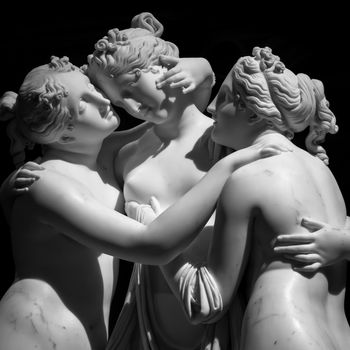 Milan, Italy - June 2020: Antonio Canova’s statue The Three Graces (Le tre Grazie). Neoclassical sculpture, in marble, of the mythological three charites (made in Rome, 1814-1817)