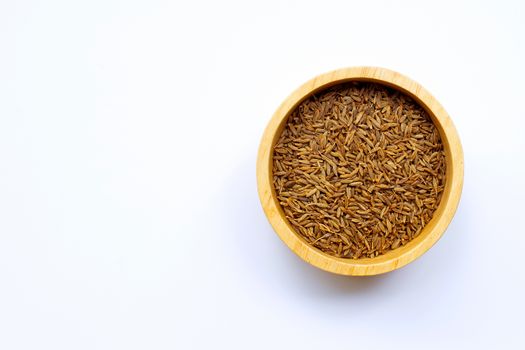Cumin or caraway seeds on white background.