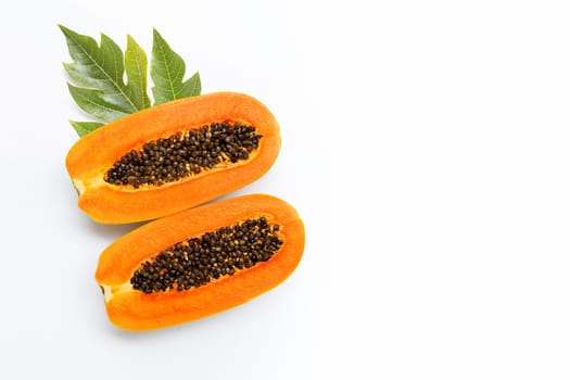 Half papaya fruit with leaf on white background. Copy space