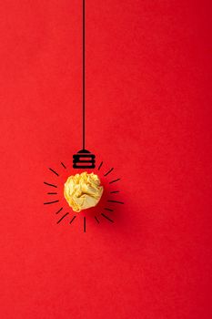 Creative idea, Inspiration, New idea and Innovation concept with Crumpled Paper light bulb on red background.