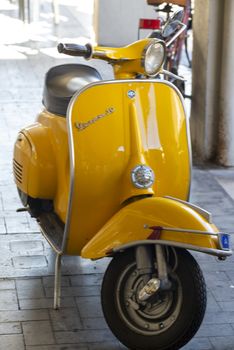 terni,italy september 05 2020:vintage piaggio vespa in yellow color